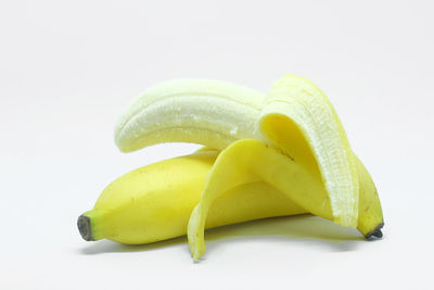 Close-up of bananas against white background