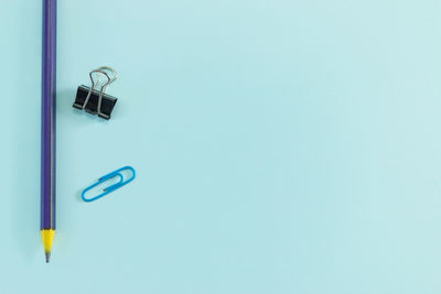 High angle view of pen against blue background