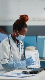 Female doctor working at clinic