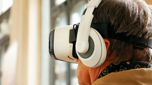 Close-up of man wearing virtual reality simulator