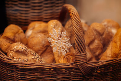 Fresh baked multigrain bread in a wicker basket in a baked goods store