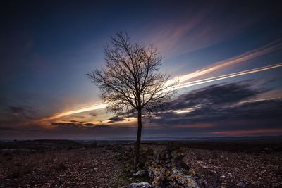 Scenic view of landscape against sky at sunset