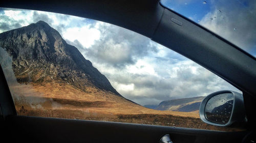 Reflection of sky on side-view mirror