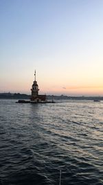 Scenic view of sea against clear sky during sunset