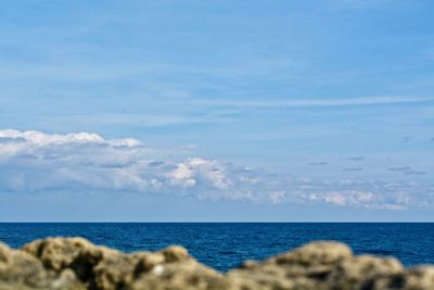 Scenic view of sea against blue sky