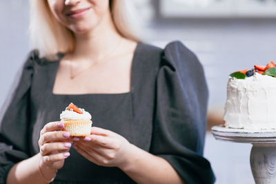 Midsection of woman having food