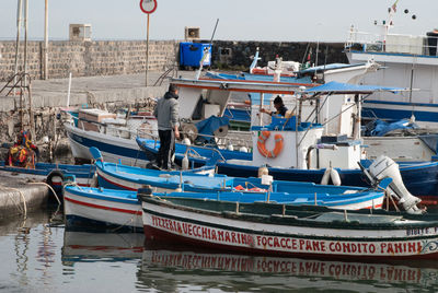 Boats moored at dock