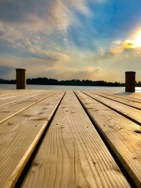 Surface level of wooden pier against sky