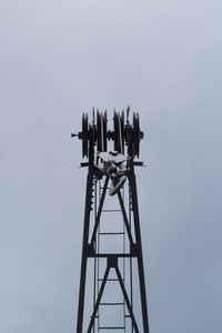 Cable car pulley against clear sky