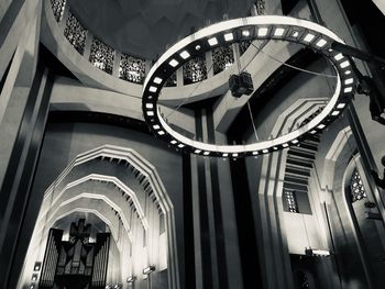 Low angle view of people on staircase in building