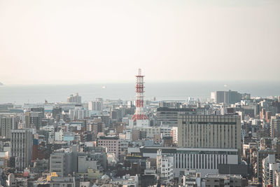 Buildings in city against sky