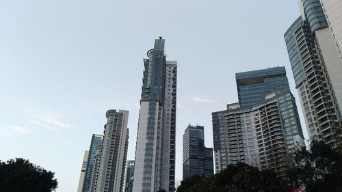 Low angle view of skyscrapers against clear sky