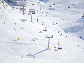 Tourists and ski lifts at ski resort