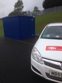 Close-up of car on road