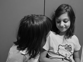Close-up of mother and daughter at home