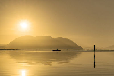 View of calm sea at sunset