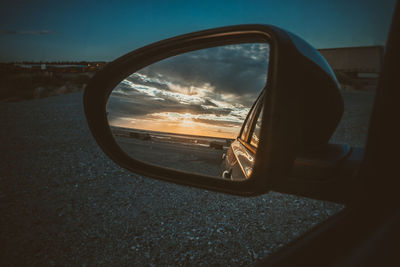 Reflection of sky on side-view mirror