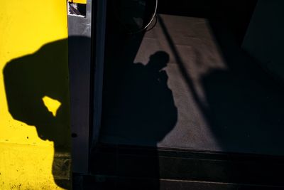 Close-up of yellow shadow on road