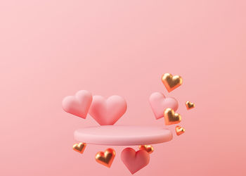 Pink podium with hearts flying in the air. valentine's day, wedding, anniversary. mockup