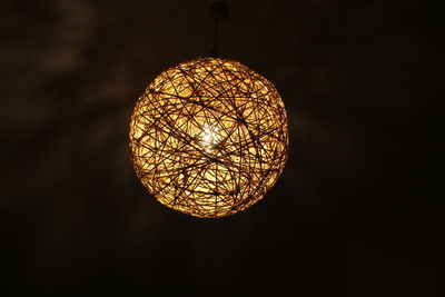 Low angle view of illuminated electric lamp