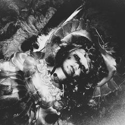 Portrait of young woman lying down