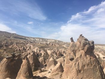 Rock formations on land against sky