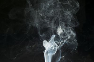 Close-up of smoke against black background