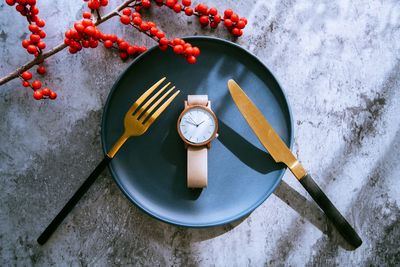 High angle view of clock on table