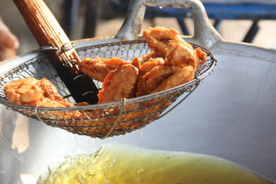 Close-up of meat in cooking pan on table