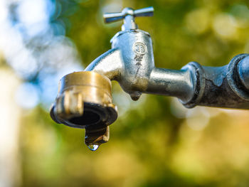 Close-up of water drops on faucet