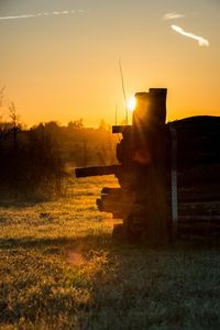 Scenic view of field against sky during sunset