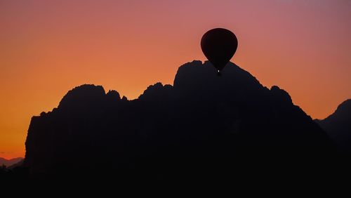 Silhouette of man against sky during sunset