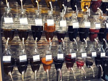 Close-up of oil bottles on table