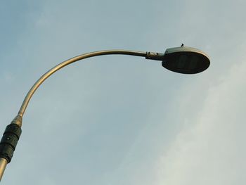 Low angle view of street light against sky