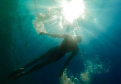 Man swimming in sea