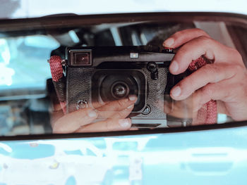 Cropped hand holding car