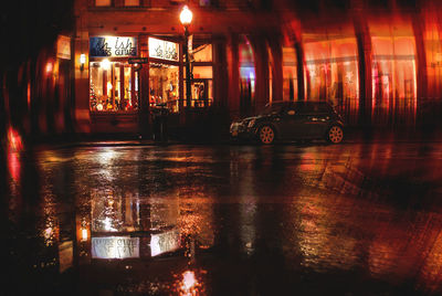 Reflection of illuminated built structure in water at night