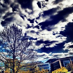 Low angle view of building against cloudy sky