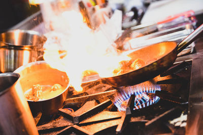 Close-up of preparing food on barbecue grill