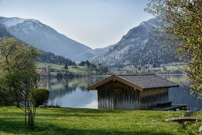 Scenic view of lake and mountains against sky