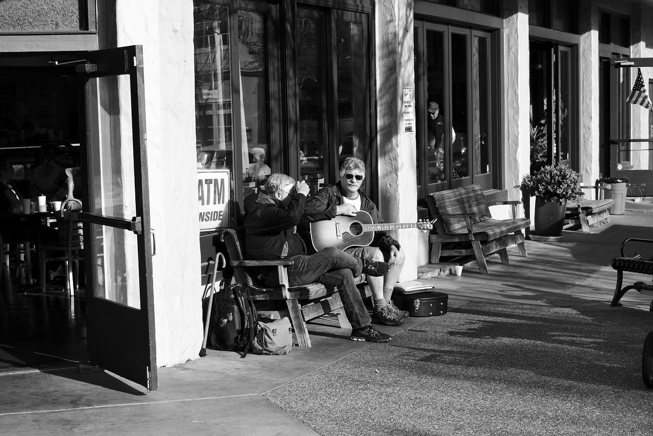 building exterior, architecture, built structure, city, street, residential building, house, residential structure, window, in a row, day, store, building, outdoors, large group of objects, chair, incidental people, no people, shop