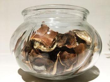 Close-up of ice cream in glass jar on table