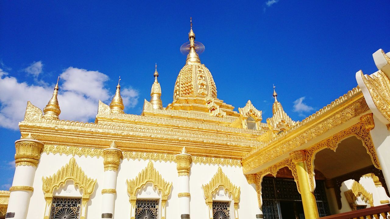 low angle view, architecture, built structure, blue, famous place, religion, travel destinations, building exterior, art and craft, spirituality, place of worship, tourism, history, art, ornate, travel, sky, human representation, sculpture, statue