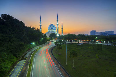 View of illuminated city at sunset