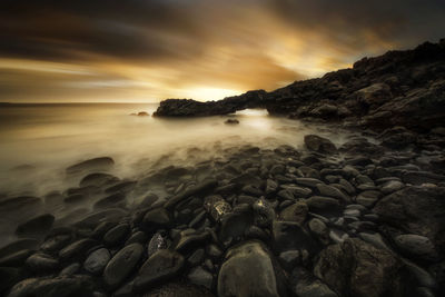 Scenic view of sea against sky during sunset
