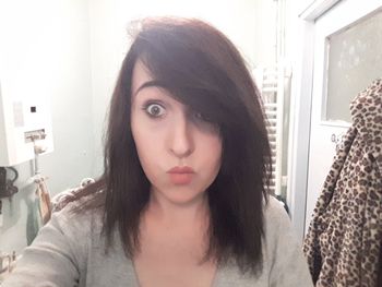 Close-up of young woman at home