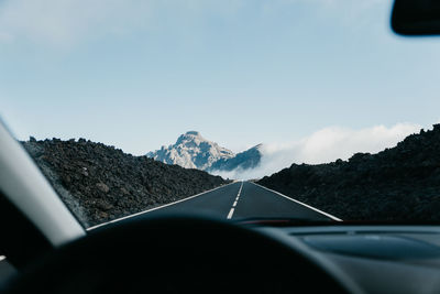Road seen through car windshield