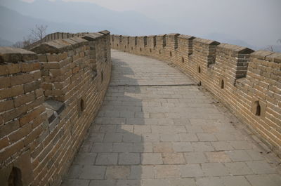 View of great wall of china leading towards mountain