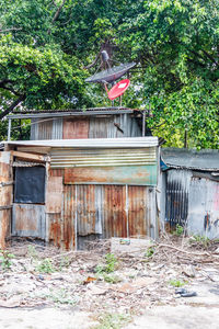 Abandoned house against trees