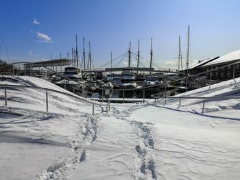 Boats moored at harbor during winter